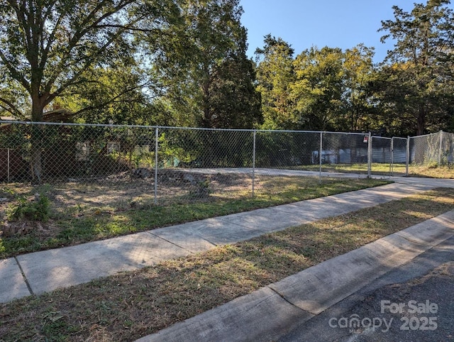 view of property's community featuring fence