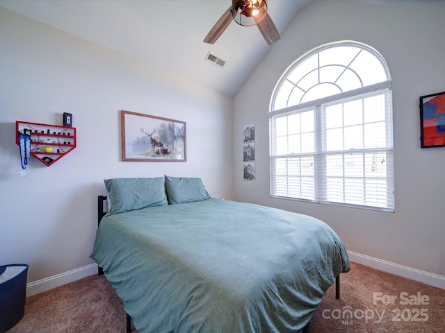 carpeted bedroom featuring ceiling fan, baseboards, visible vents, and vaulted ceiling