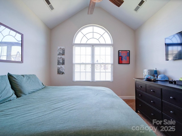 bedroom featuring a ceiling fan, dark colored carpet, visible vents, and lofted ceiling