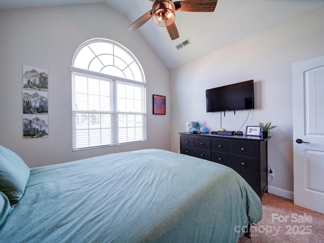 bedroom with lofted ceiling, multiple windows, visible vents, and light colored carpet