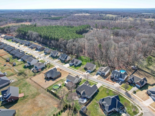 aerial view featuring a residential view and a view of trees