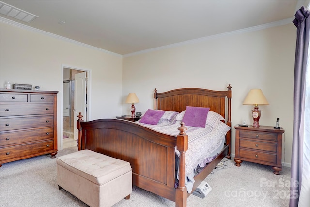 bedroom featuring connected bathroom, visible vents, crown molding, and light carpet