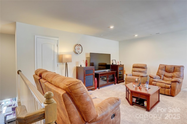 living room featuring recessed lighting and light carpet