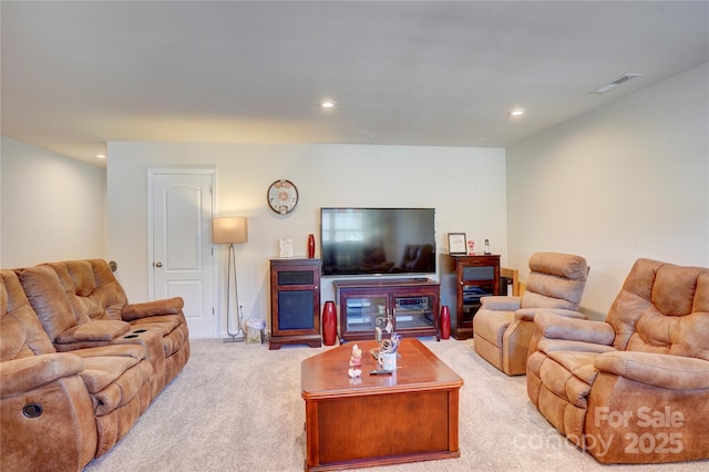 living area with recessed lighting, light colored carpet, and visible vents