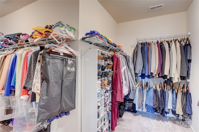 spacious closet with visible vents and carpet flooring