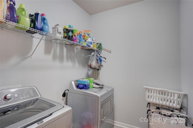 washroom featuring laundry area and separate washer and dryer