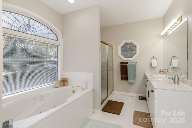 full bathroom featuring double vanity, baseboards, a tub with jets, a shower stall, and a sink