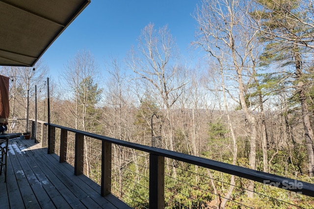 deck featuring a view of trees