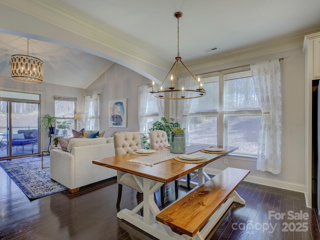 dining space featuring baseboards, a chandelier, vaulted ceiling, and dark wood-style flooring