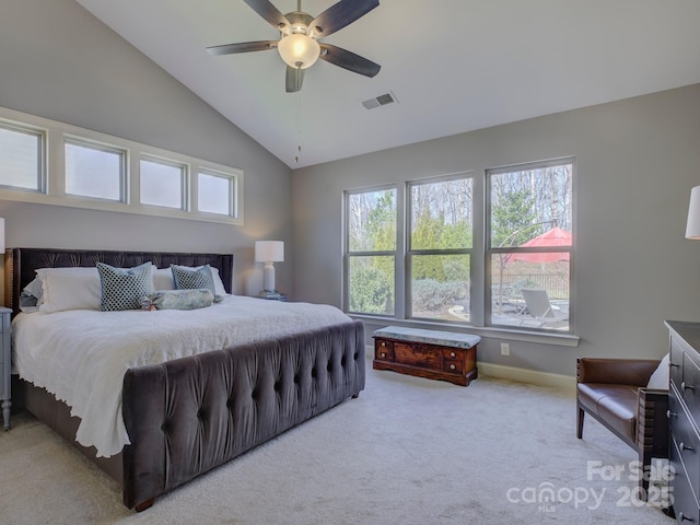 carpeted bedroom with ceiling fan, baseboards, visible vents, and vaulted ceiling