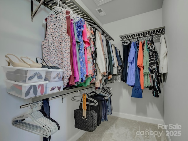 walk in closet featuring carpet and visible vents