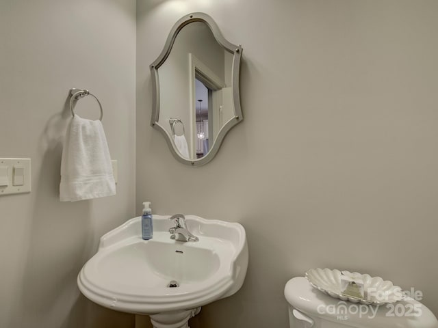 bathroom with a sink and toilet