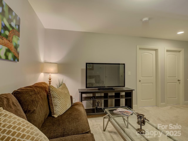 living area with carpet floors, baseboards, and recessed lighting