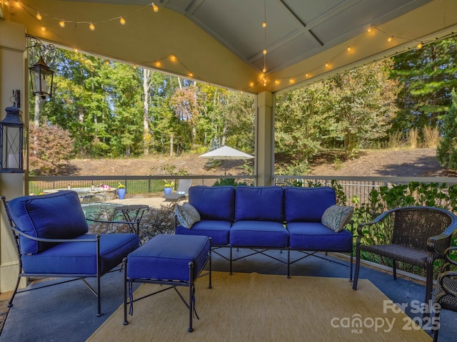 view of patio / terrace featuring fence and an outdoor living space