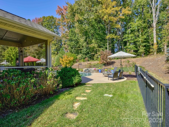 view of yard featuring a patio area and fence