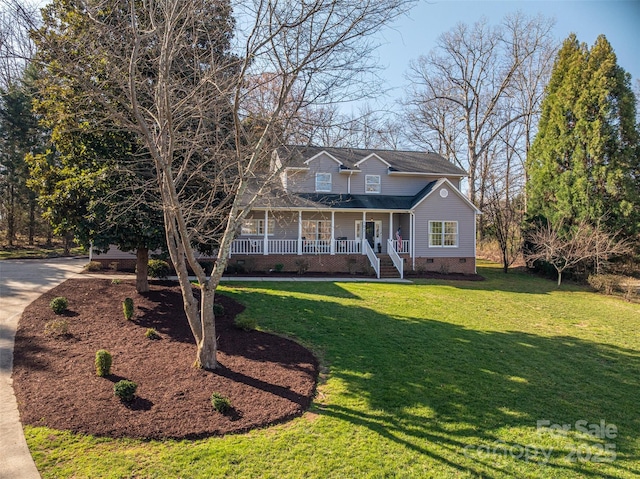 view of front of house featuring crawl space, a porch, concrete driveway, and a front yard