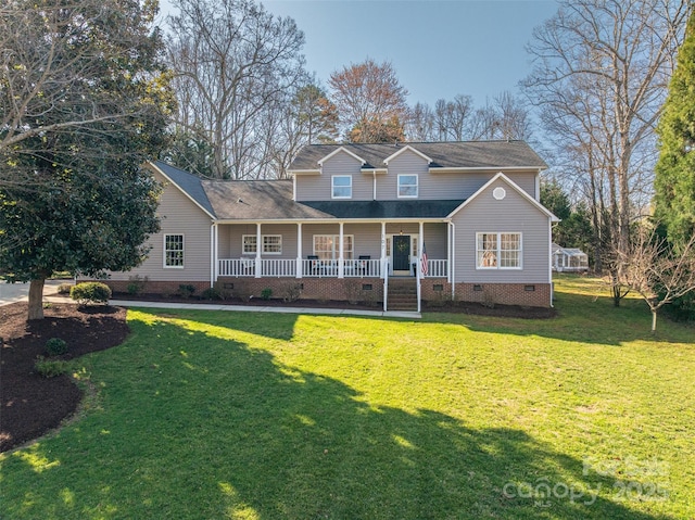 traditional-style house with a porch, a front yard, roof with shingles, and crawl space