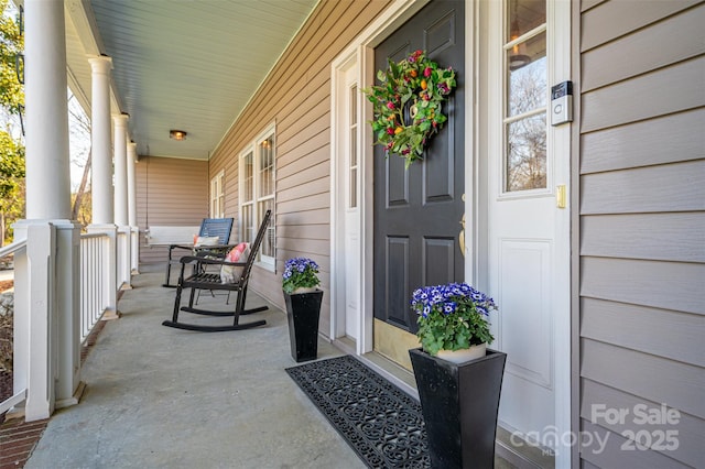 entrance to property featuring a porch