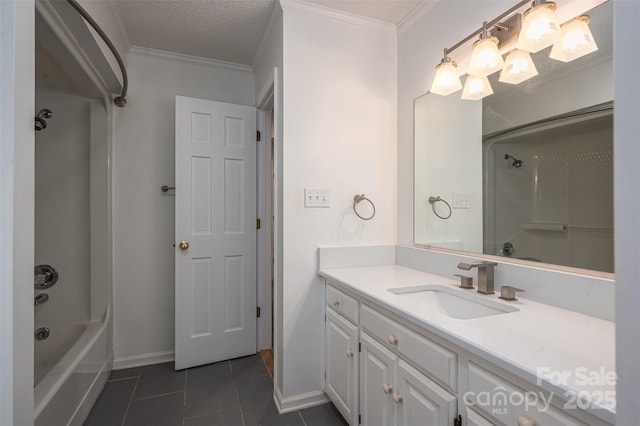 bathroom with a textured ceiling, ornamental molding, vanity, and tile patterned flooring