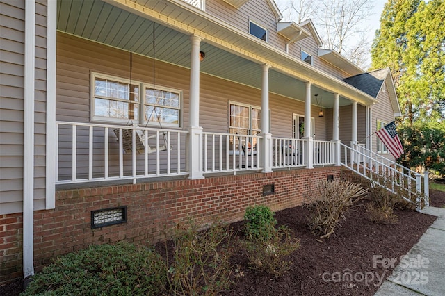 view of home's exterior featuring crawl space and covered porch