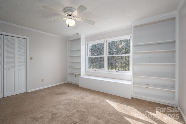 107 Doris Ct, Lincolnton, NC 28092 - unfurnished bedroom with carpet, ornamental molding, a textured ceiling, ceiling fan, and baseboards