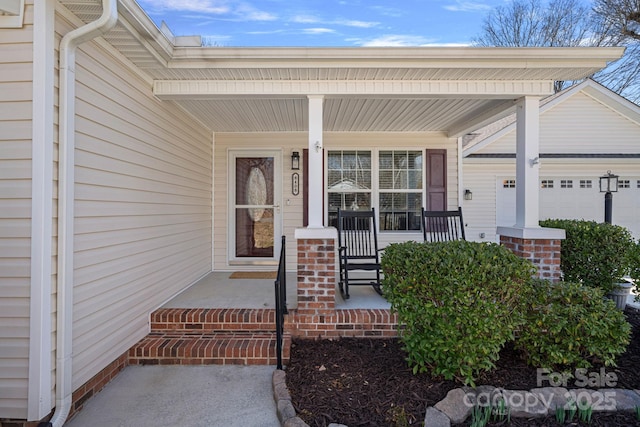 entrance to property with covered porch