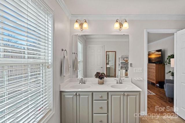 full bathroom with ensuite bath, crown molding, and a sink