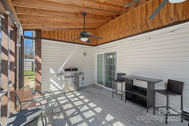 view of patio with a grill and a ceiling fan