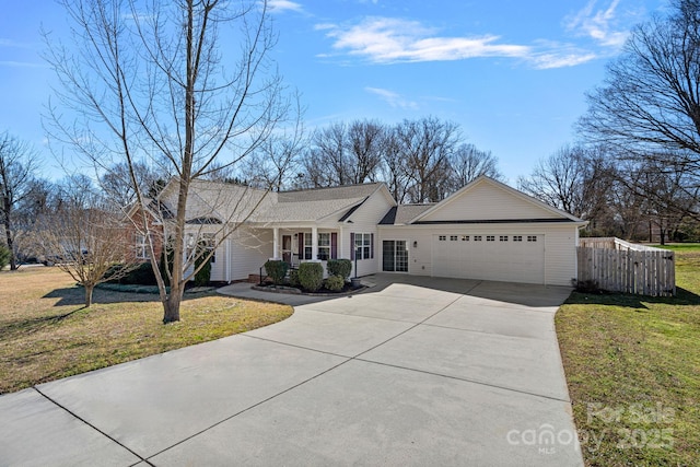 ranch-style home featuring concrete driveway, an attached garage, a front lawn, and fence