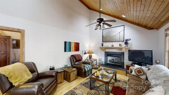 living area featuring a fireplace, wooden ceiling, wood finished floors, and a ceiling fan