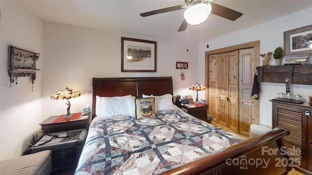 bedroom with ceiling fan and a closet