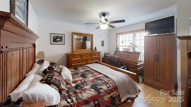 bedroom with light wood-style floors and ceiling fan