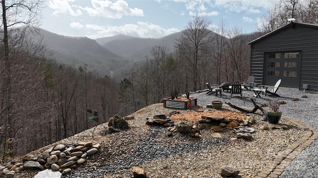 property view of mountains featuring a view of trees