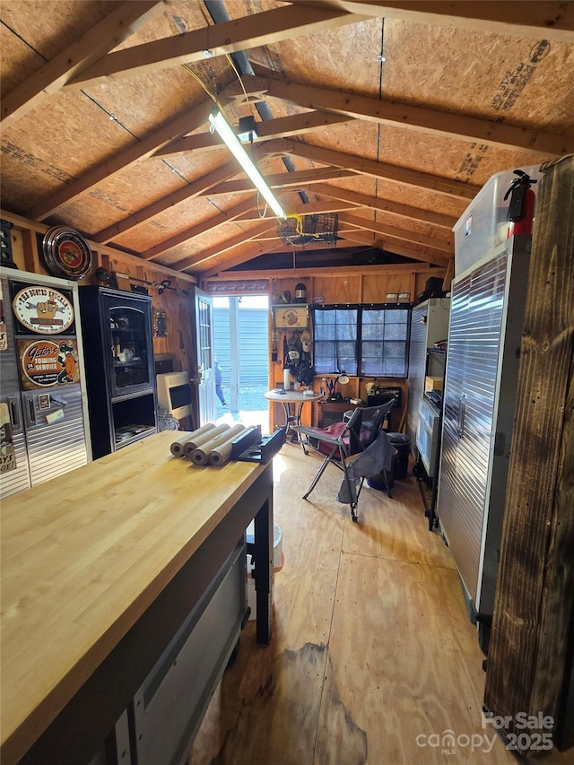 recreation room featuring lofted ceiling and wood finished floors