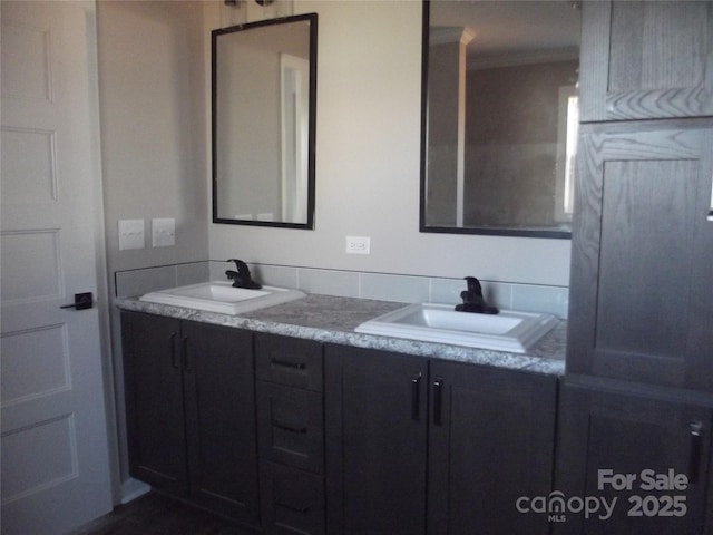 full bath featuring double vanity and a sink