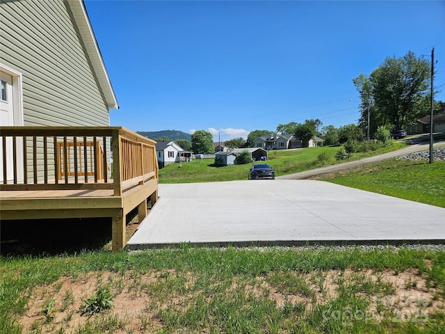 784 Severt Cir NE, Lenoir, NC 28645 - view of green lawn with a deck with mountain view and a residential view