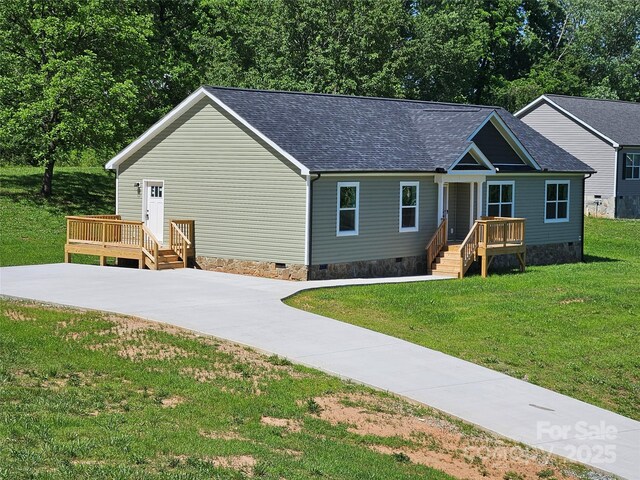 784 Severt Cir NE, Lenoir, NC 28645 - view of front of property with crawl space, roof with shingles, a front yard, a deck, and driveway