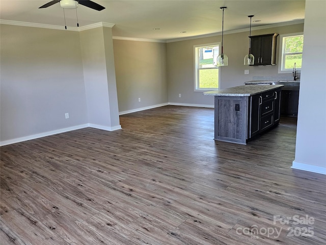 784 Severt Cir NE, Lenoir, NC 28645 - kitchen featuring open floor plan, plenty of natural light, baseboards, a sink, and crown molding
