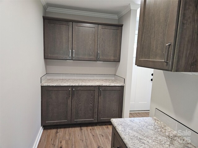 784 Severt Cir NE, Lenoir, NC 28645 - laundry area with light wood-style flooring, crown molding, and baseboards