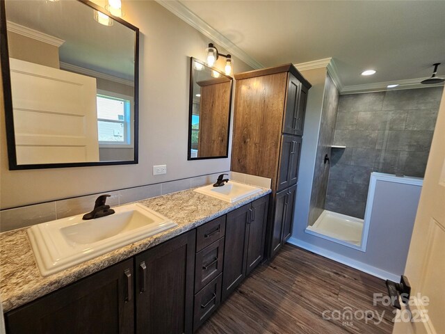 784 Severt Cir NE, Lenoir, NC 28645 - bathroom with ornamental molding, tiled shower, wood finished floors, double vanity, and recessed lighting
