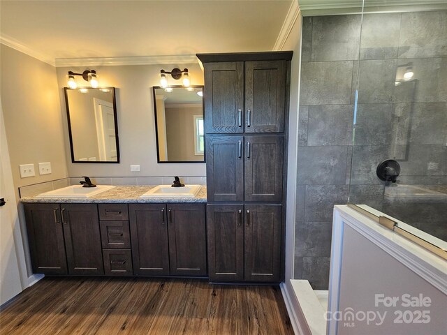 784 Severt Cir NE, Lenoir, NC 28645 - bathroom featuring ornamental molding, walk in shower, wood finished floors, and double vanity