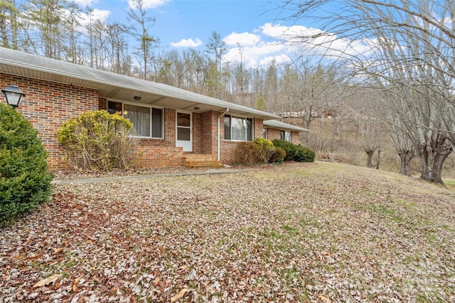 view of side of property with brick siding