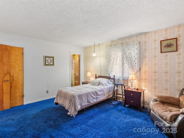 bedroom with baseboards, carpet floors, and a textured ceiling