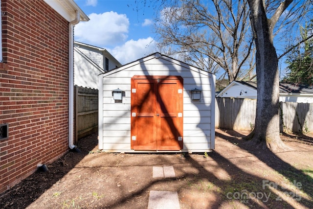 view of shed featuring a fenced backyard