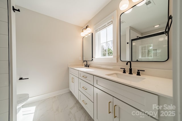 bathroom with visible vents, marble finish floor, a sink, and a stall shower