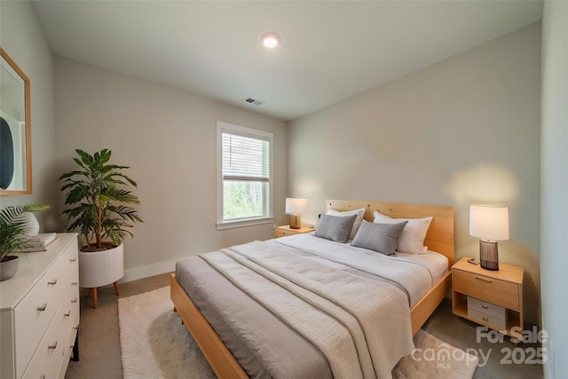 bedroom with light colored carpet, baseboards, and visible vents