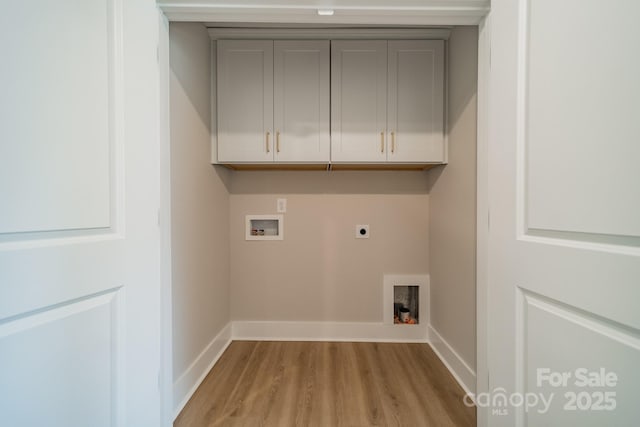 laundry room featuring electric dryer hookup, baseboards, washer hookup, cabinet space, and light wood finished floors