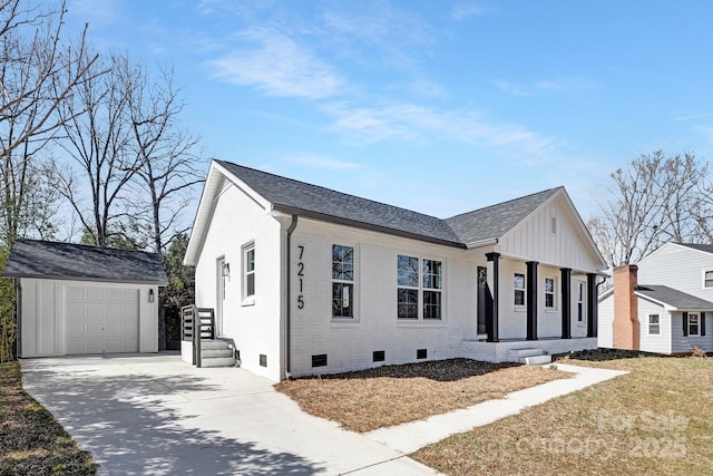 modern inspired farmhouse with driveway, crawl space, an outdoor structure, board and batten siding, and brick siding