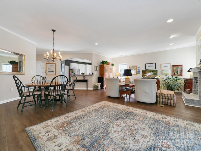 dining space with a healthy amount of sunlight and dark wood-style flooring