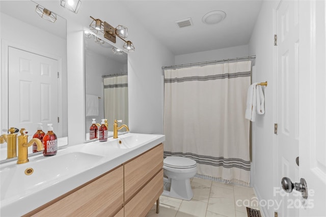 bathroom with marble finish floor, visible vents, a sink, and toilet